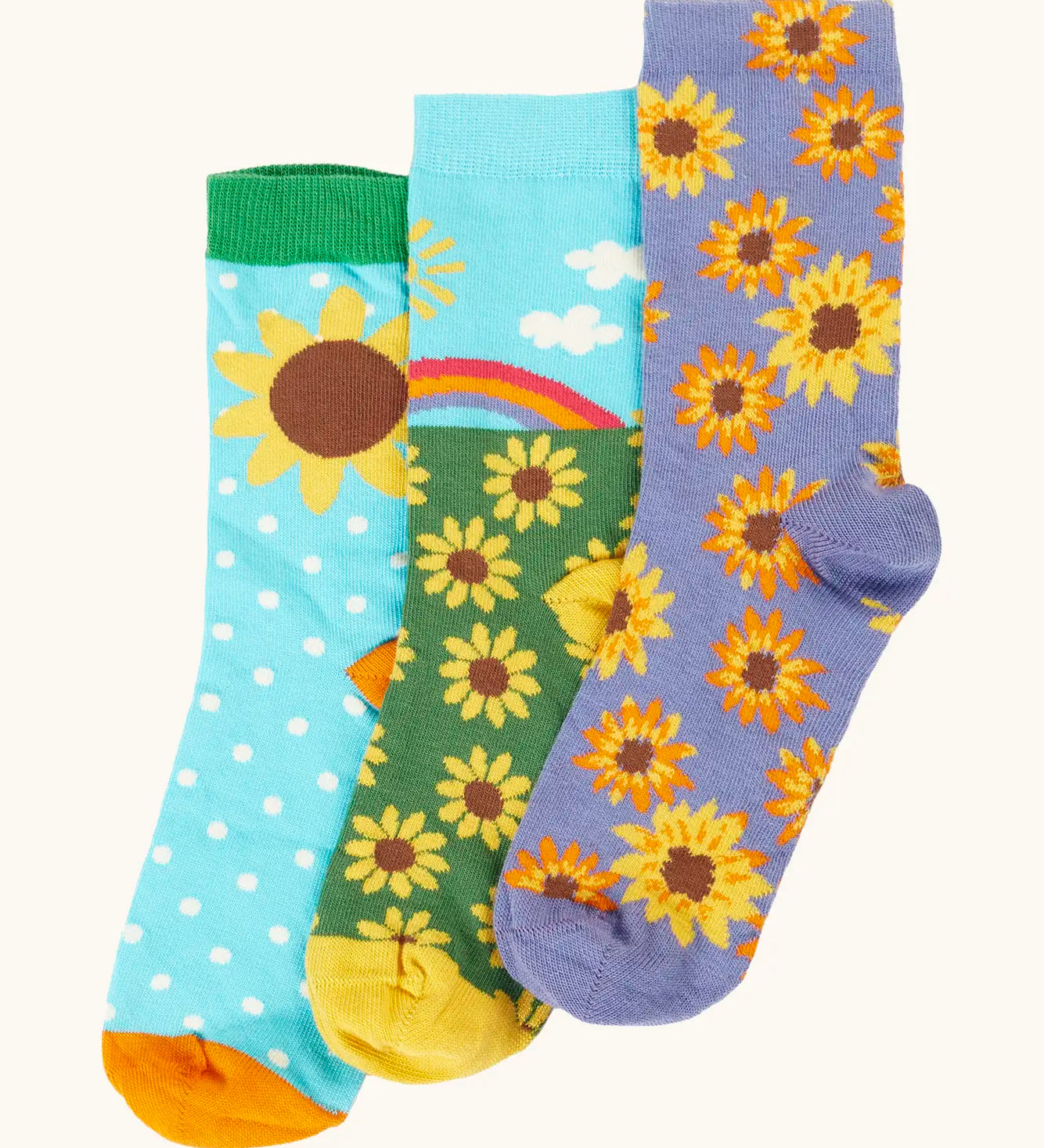 Frugi 100% organic cotton rock my socks 3 pack in bright colours with sunflower inspired designs. 