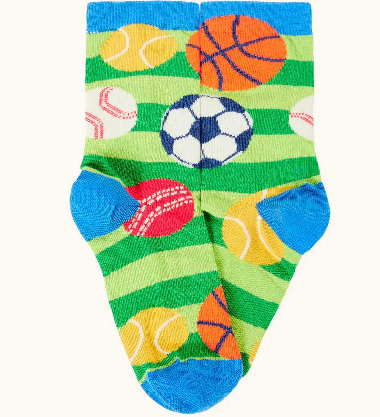 Frugi 100% organic cotton sock in green stripes with different repeating sport balls designs. Showing blue heel and toe panel