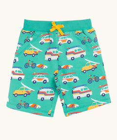 Frugi 100% organic cotton shorts in light green with repeating beach theme vehicles. Shows side pockets and yellow waist tie