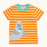 Frugi 100% organic cotton short sleeve t-shirt in orange and white stripes with a seal patch on the front and light blue collar trim