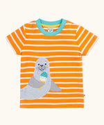 Frugi 100% organic cotton short sleeve t-shirt in orange and white stripes with a seal patch on the front and light blue collar trim