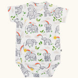 Frugi 100% organic cotton baby bodysuit in white with a repeating  elephant print. Shows full length front and crotch popper fastener 