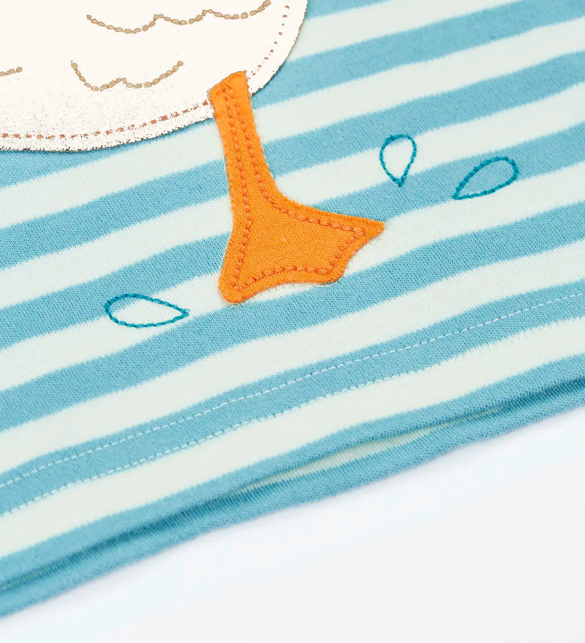 Close up of the duck patch on the Frugi 100% organic cotton blue and white striped t-shirt showing the feet detail