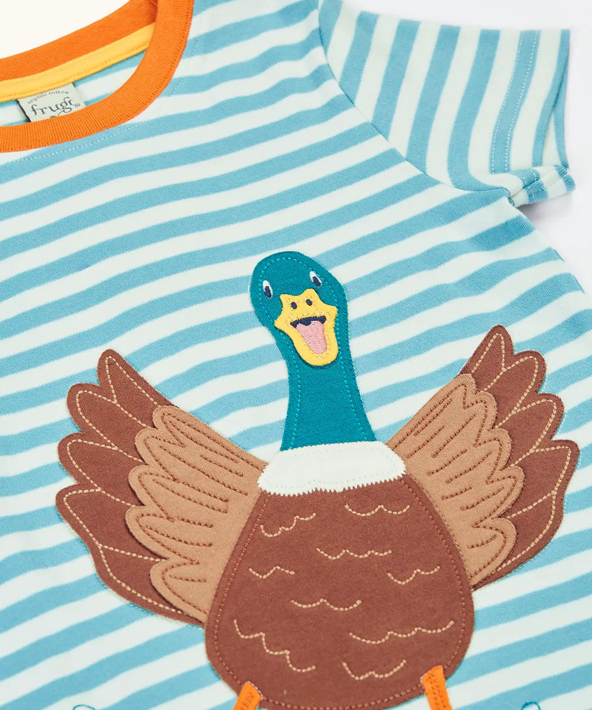 Frugi 100% organic cotton blue and white striped Sid t-shirt laid flat showing a large playful duck patch on the front