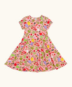 Frugi 100% organic cotton spring skater dress in pink with a repeating fruit and veg print.