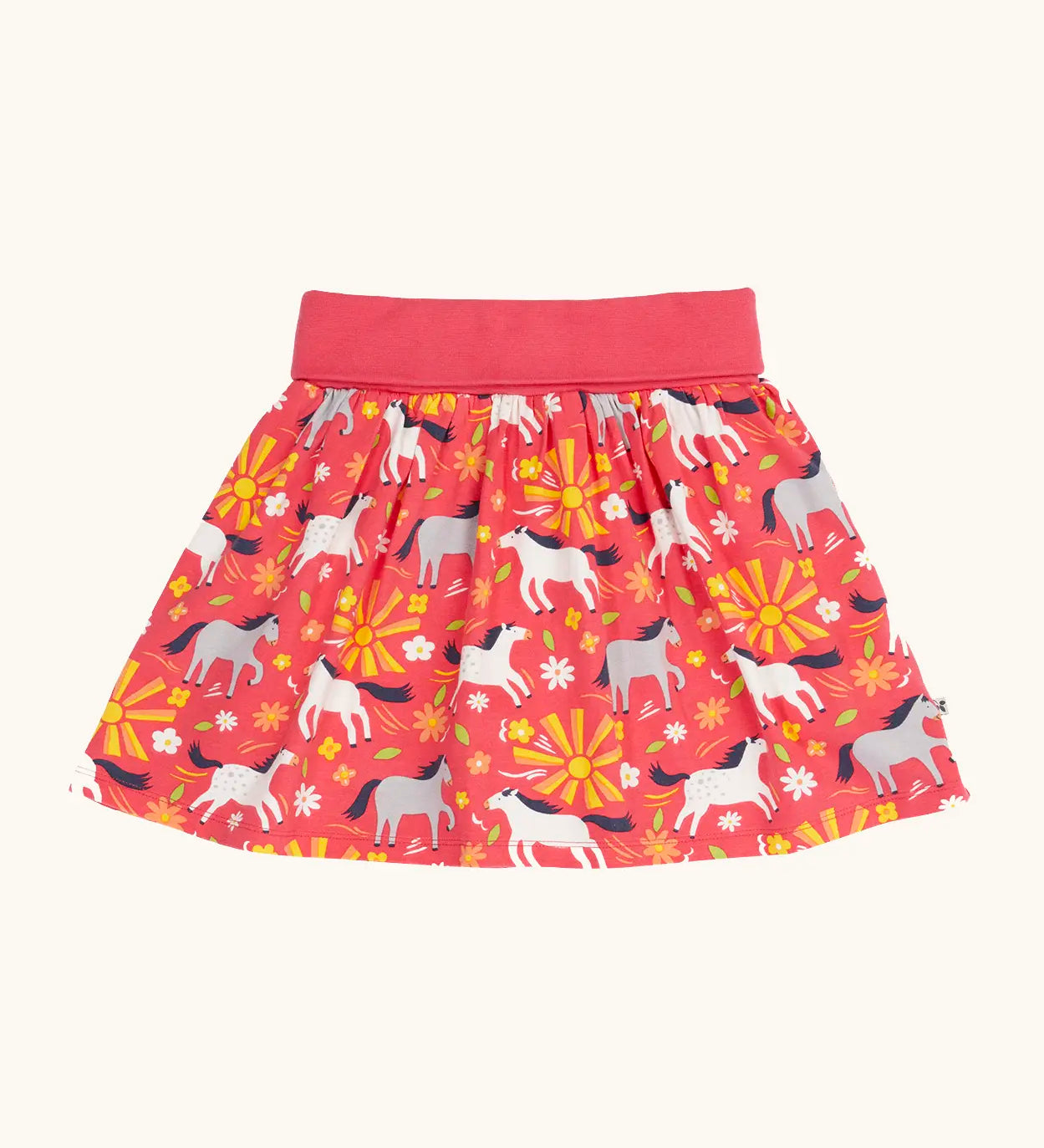 Frugi 100% organic cotton spring skort in coral pink with a repeating white and grey pony and sunshine print.