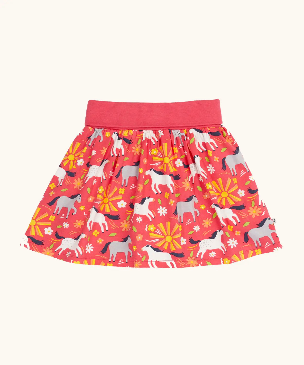 Frugi 100% organic cotton spring skort in coral pink with a repeating white and grey pony and sunshine print.