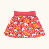 Frugi 100% organic cotton spring skort in coral pink with a repeating white and grey pony and sunshine print.