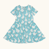 Frugi 100% organic cotton sunshine skater dress in light blue with a repeating white goose print. 