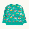Frugi 100% organic cotton sweatshirt in light green with repeating beach inspired vehicles. Shows elasticated cuff and hem