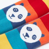 A close up of the pandas on the knees of the Frugi toasty tights in big rainbow stripes/panda available at Babipur. A GOTS organic cotton tights with bright and bold rainbow stripes with a panda design on the knees.
