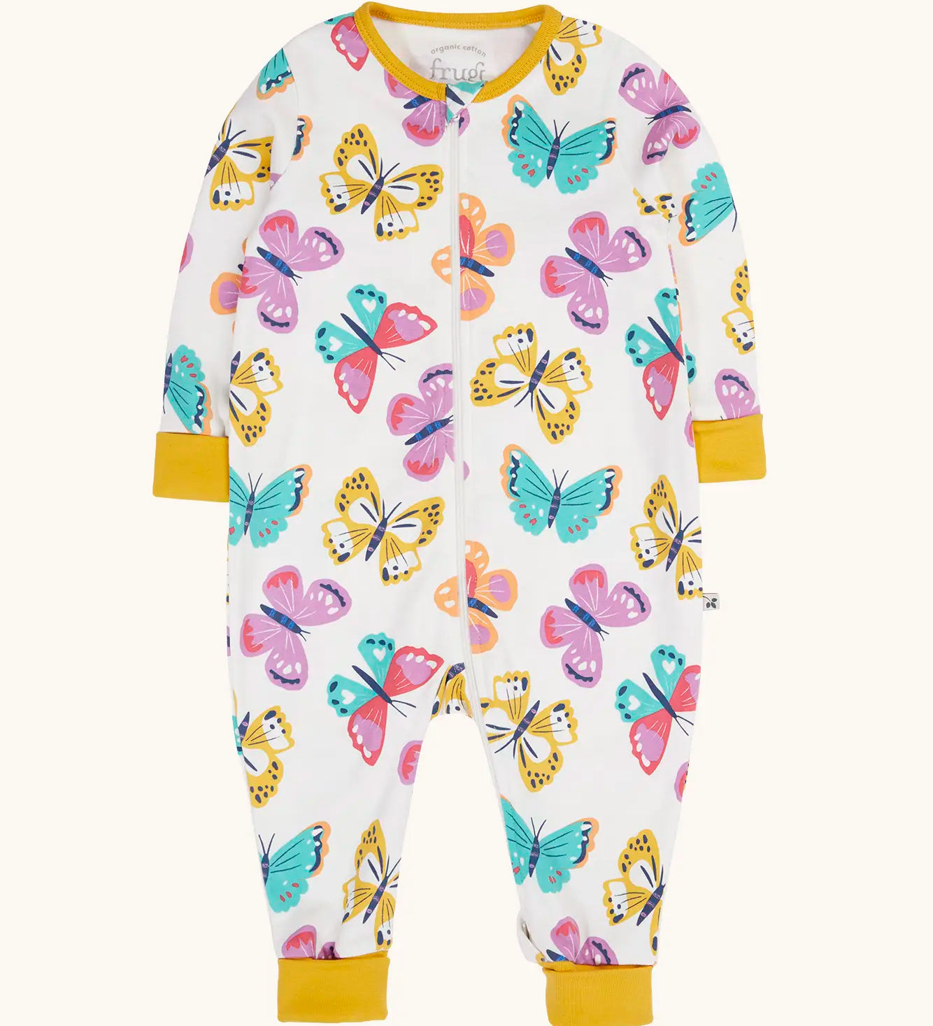 Frugi 100% organic cotton Zelah all in one in white with a repeating butterfly print. Showing full length front zip