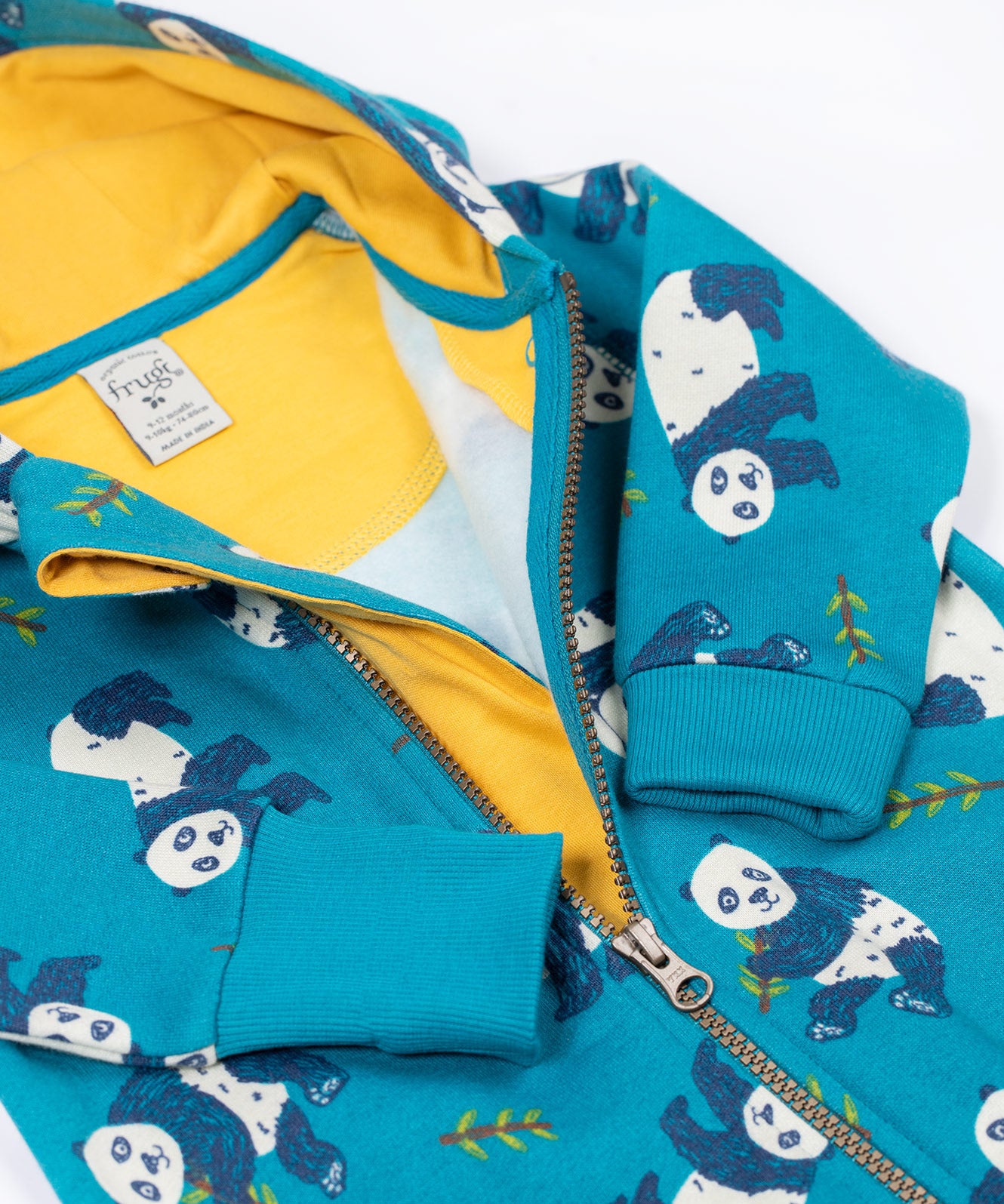 A close up of the front zip closure on the Frugi snuggle suit in panda pals available at Babipur. A GOTS organic cotton light blue hooded all in one with a playful panda design. Features a full length zip fastener. 