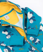 A close up of the front zip closure on the Frugi snuggle suit in panda pals available at Babipur. A GOTS organic cotton light blue hooded all in one with a playful panda design. Features a full length zip fastener. 