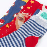 A close up of the Frugi rock my socks 3 in festive multipack available at Babipur. GOTS socks in 3 different designs including a striped with a yeti, a red with reindeer and a blue sock with a cute robin design.