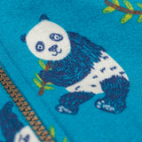 A close up of a panda fearured on teh print on the Frugi snuggle suit in panda pals available at Babipur. A GOTS organic cotton light blue hooded all in one with a playful panda design. Features a full length zip fastener.