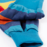 A close up of the leg cuffs on the Frugi parsnip pants in big rainbow stripe available at Babipur. A GOTS organic cotton bottom in bold rainbow inspired striped design. Features blue elasticated cuffs