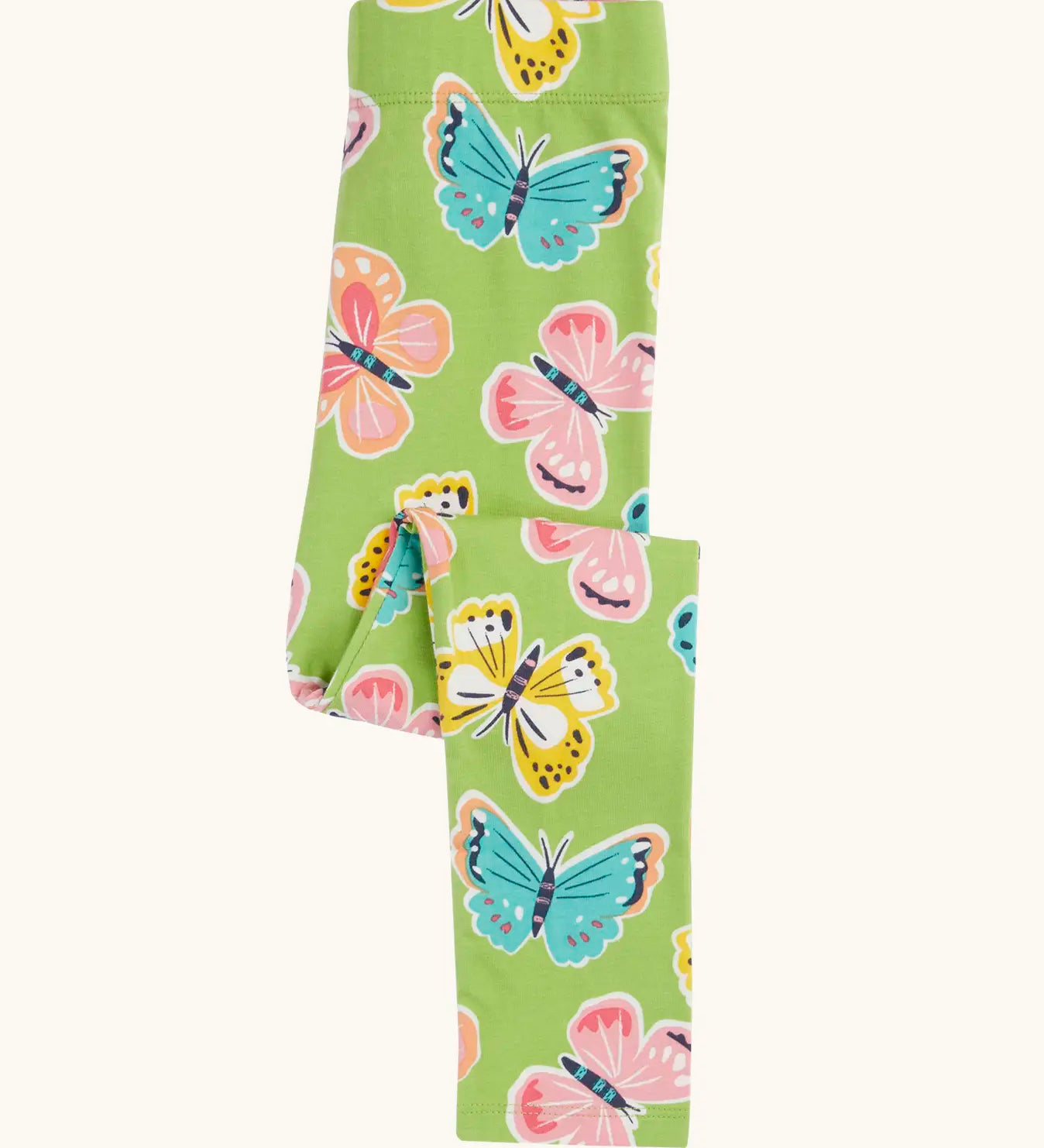 Folded Frugi 100% organic cotton green Leona leggings with a repeating butterfly design