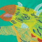 Frugi kids green stop in a green colour with a triceratops design embroidery detail
