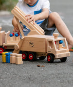 Fagus garbage tipper, a wooden rubbish van with working tipping mechanism, four peg dolls and wheelie bins.
