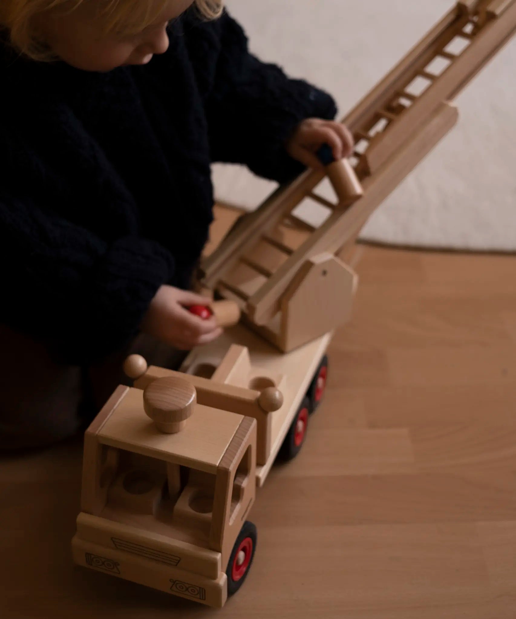 Fagus fire engine toy, beautifully crafted from wood with an extendable rotating 3-piece ladder.