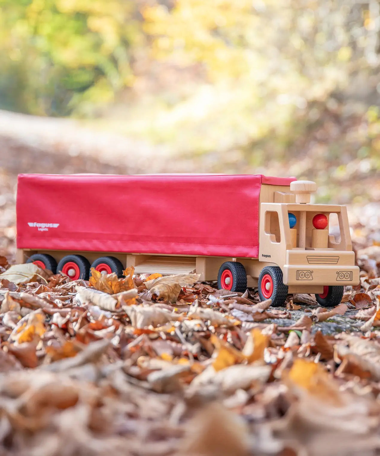 Fagus wooden semi trailer lorry with working steering, rubber wheels and two peg dolls.