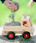 Fagus wooden toy truck, with working steering, a tow bar, rubber wheels and two Fagus peg dolls.