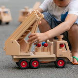 Fagus wooden fire engine toy, heirloom quality with an extendable rotating 3-piece ladder, rubber wheels and 6 peg doll figures.