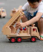 Fagus wooden fire engine toy, heirloom quality with an extendable rotating 3-piece ladder, rubber wheels and 6 peg doll figures.