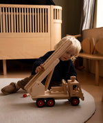 Fagus fire engine wooden toy with heirloom quality, an extendable rotating 3-piece ladder, rubber wheels and 6 peg doll figures.
