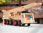 Fagus fire engine wooden toy featuring an extendable rotating 3-piece ladder, rubber wheels and 6 peg doll figures.