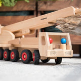 Fagus fire engine wooden toy featuring an extendable rotating 3-piece ladder, rubber wheels and 6 peg doll figures.