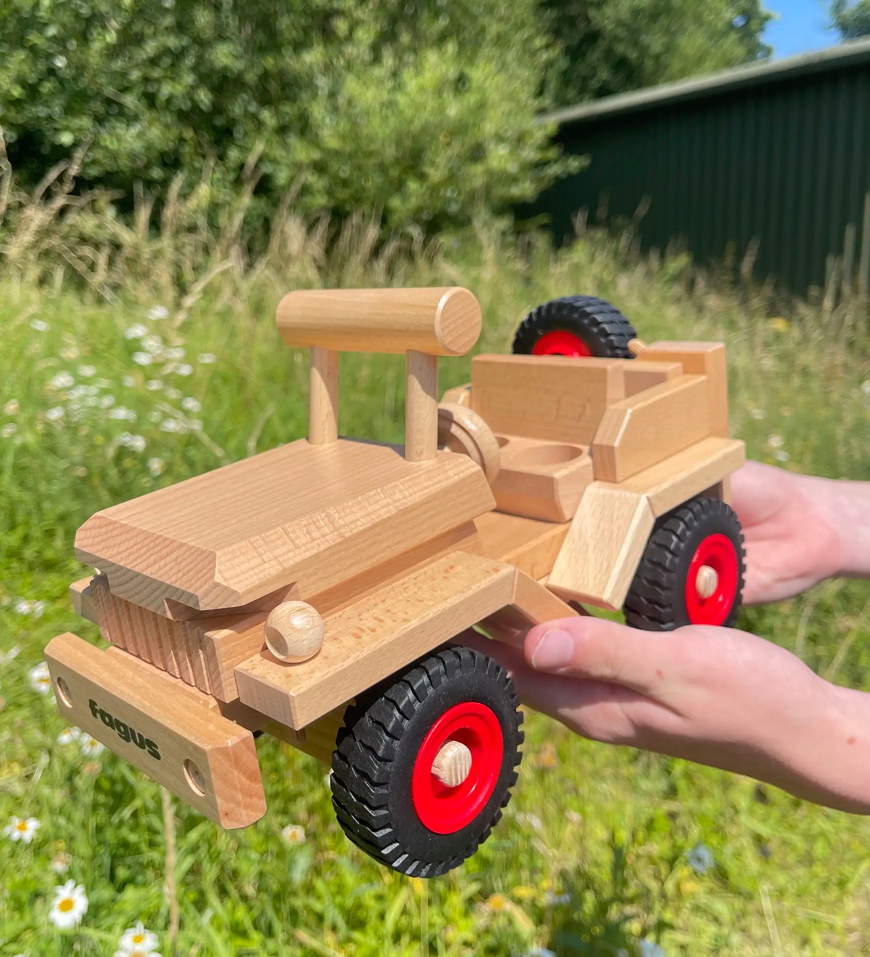 Fagus Wooden Toy Jeep with working steering, a spare wheel on the back.