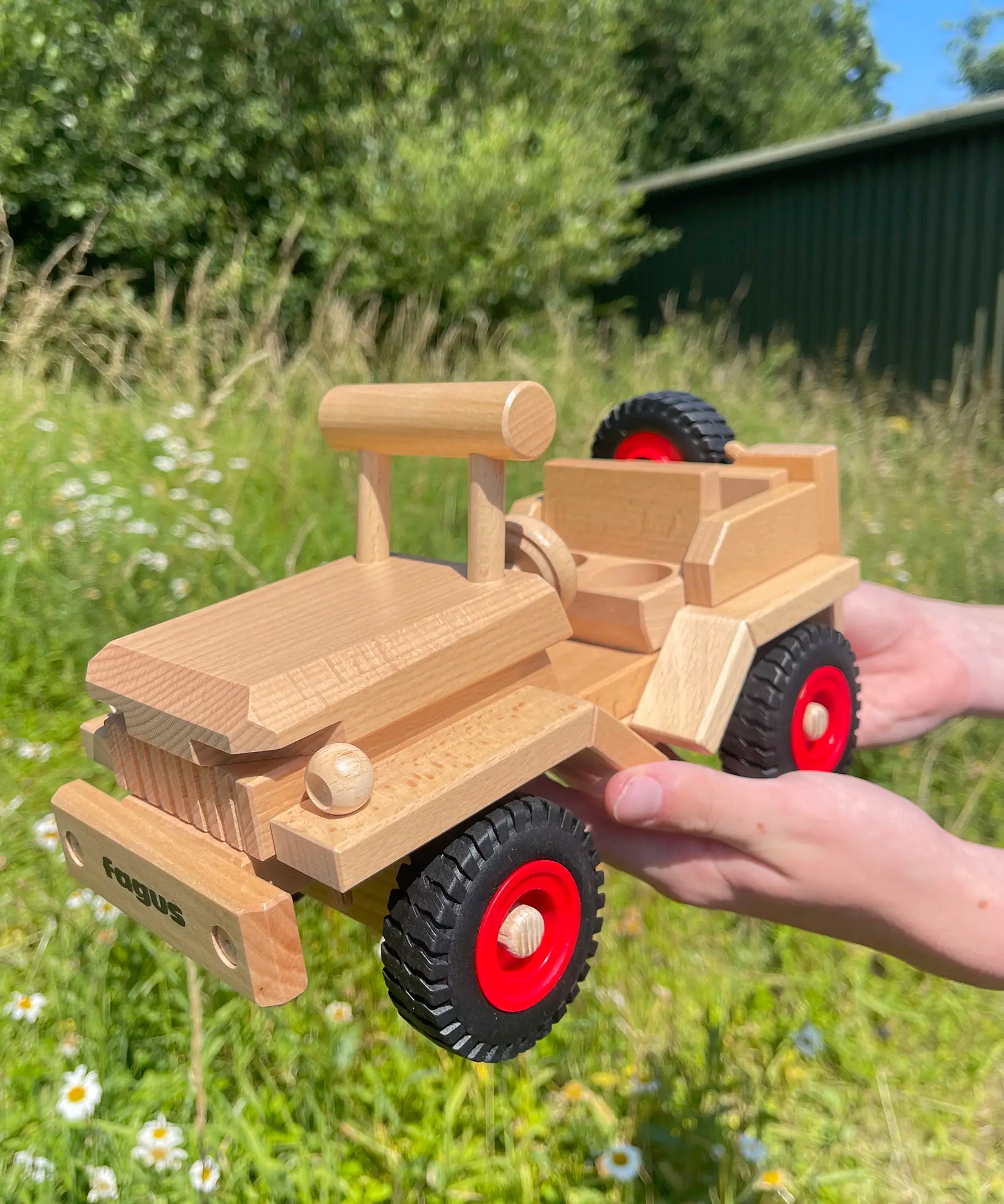 Fagus Wooden Toy Jeep with working steering, a spare wheel on the back.
