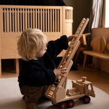 Fagus fire engine wooden toy featuring an extendable rotating 3-piece ladder, working steering and 6 peg doll figures.