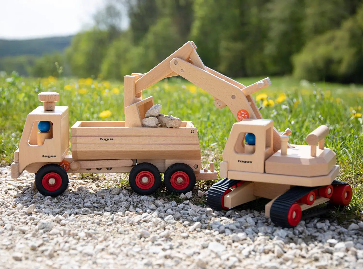 Fagus excavator, a wooden toy for small world play with the Fagus wooden container tipper truck.
