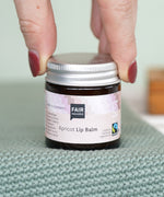 Fair Squared Fairtrade Apricot Plastic Free Lip Balm stored a glass jar, available to buy at Babipur.
