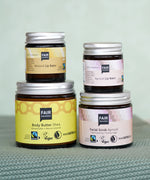 A collection of Fair Squared Fairtrade Lip balm, body butter and face scrub, all vegan, cruelty free and plastic free, for sale at Babipur.