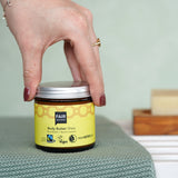 Jar of Fair Squared Fairtrade Shea Body Butter in a bathroom, made with vegan ingredients, for sale at Babipur.