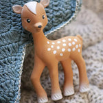 Fanfan The Fawn Baby Teether, laid on a blue and cream knitted blanket 