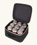 An open carbon black Fluf square lunch bag showing drink cans standing inside. Lunch bag features a a rinseable, food-safe lining