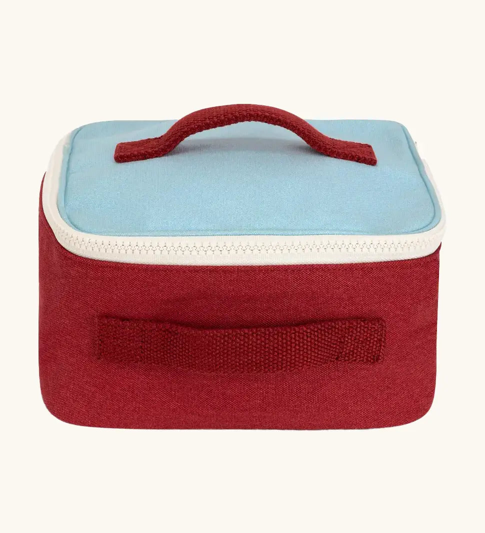 Fluf GOTS organic cotton square lunch bag in red with a blue top panel and white zip detail. Features a red carry handle on the top and side