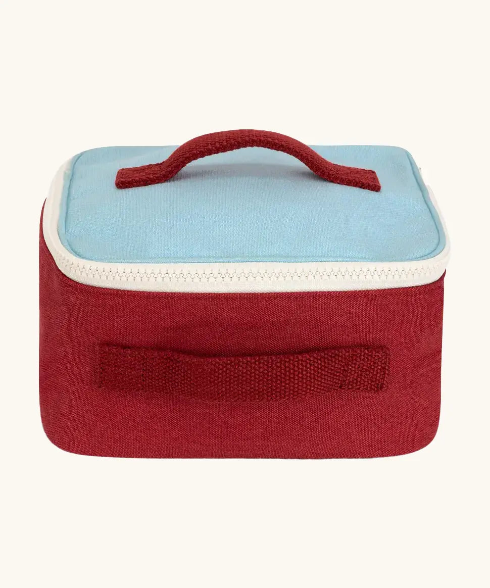 Fluf GOTS organic cotton square lunch bag in red with a blue top panel and white zip detail. Features a red carry handle on the top and side