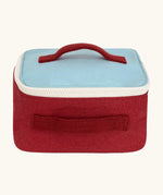 Fluf GOTS organic cotton square lunch bag in red with a blue top panel and white zip detail. Features a red carry handle on the top and side