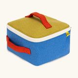 Side of a Fluf GOTS organic cotton square lunch bag in a blue with green top panel showing the white zip detail and red carry handles
