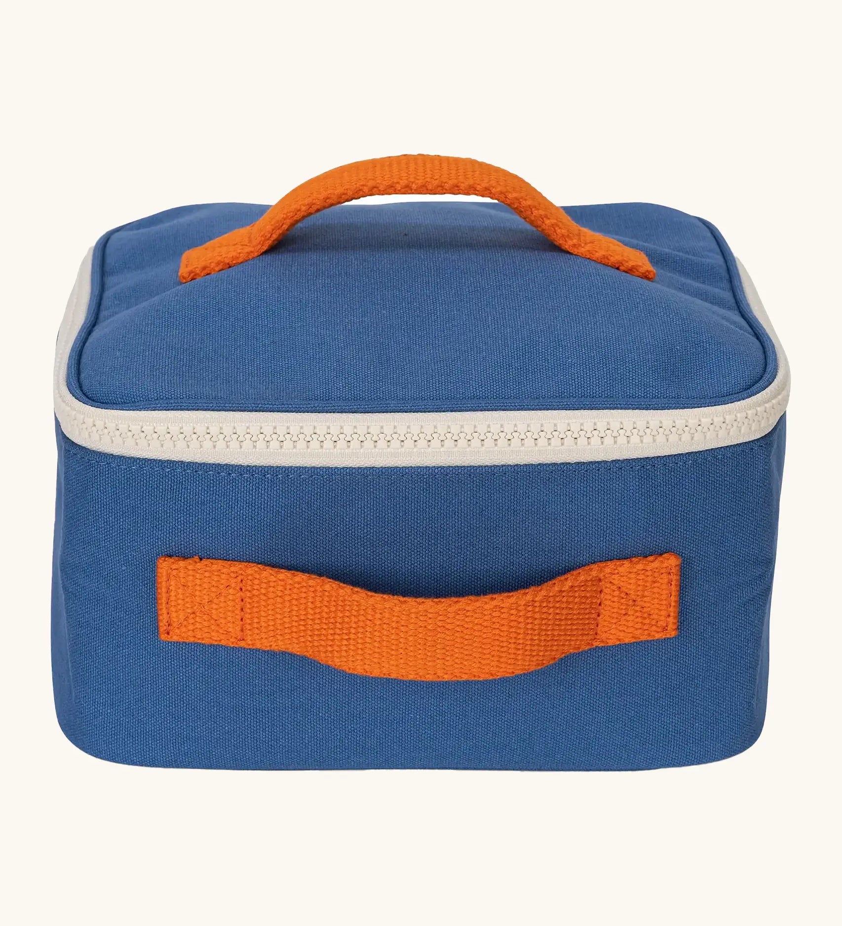 Fluf GOTS organic cotton square lunch bag in a blue with a white zip detail. Features a orange carry handle on the top and side