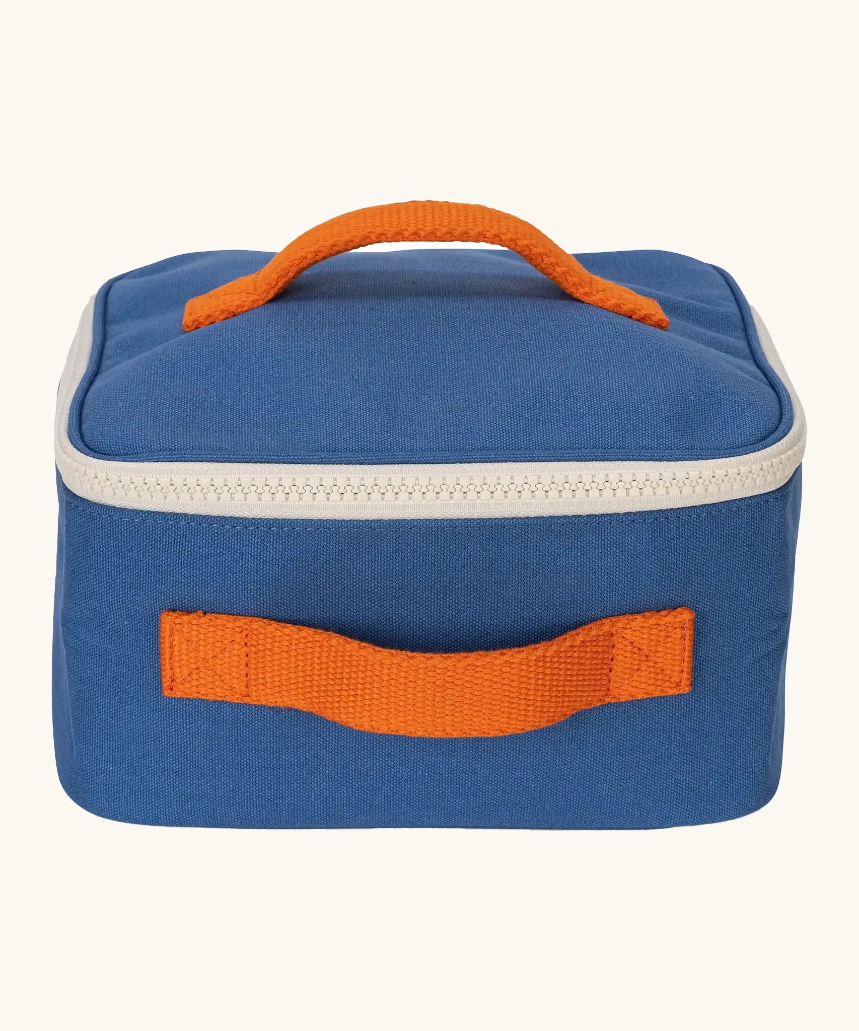 Fluf GOTS organic cotton square lunch bag in a blue with a white zip detail. Features a orange carry handle on the top and side