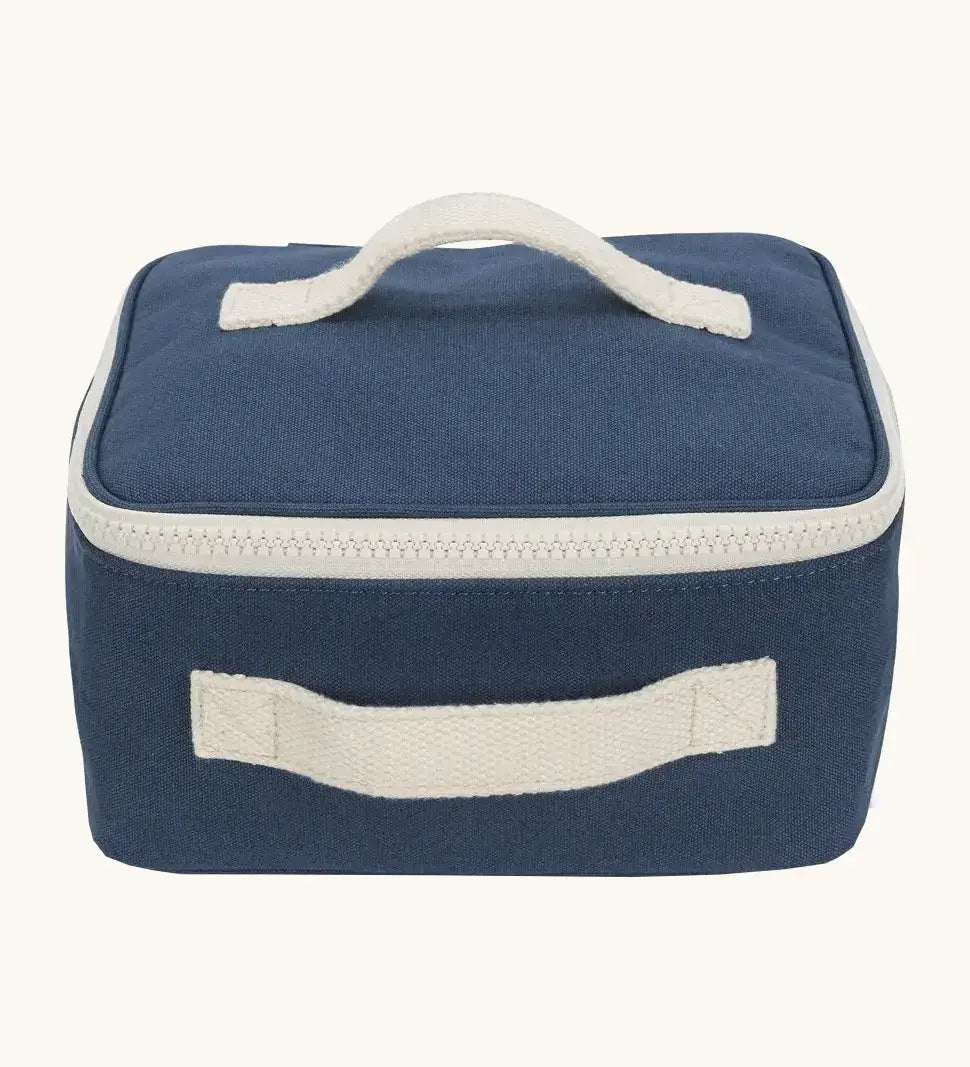 Fluf GOTS organic cotton square lunch bag in a navy with a white zip detail. Features a white carry handle on the top and side