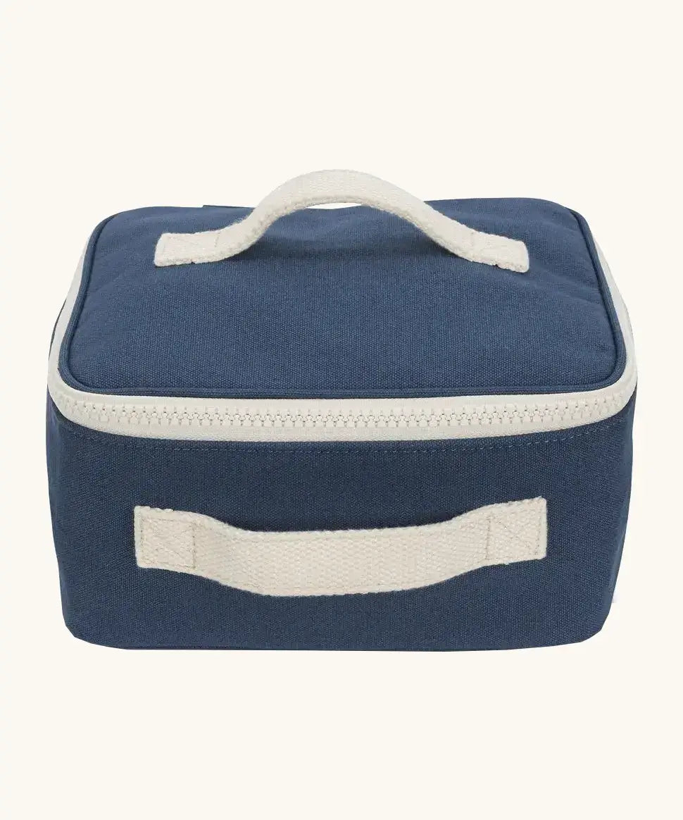 Fluf GOTS organic cotton square lunch bag in a navy with a white zip detail. Features a white carry handle on the top and side