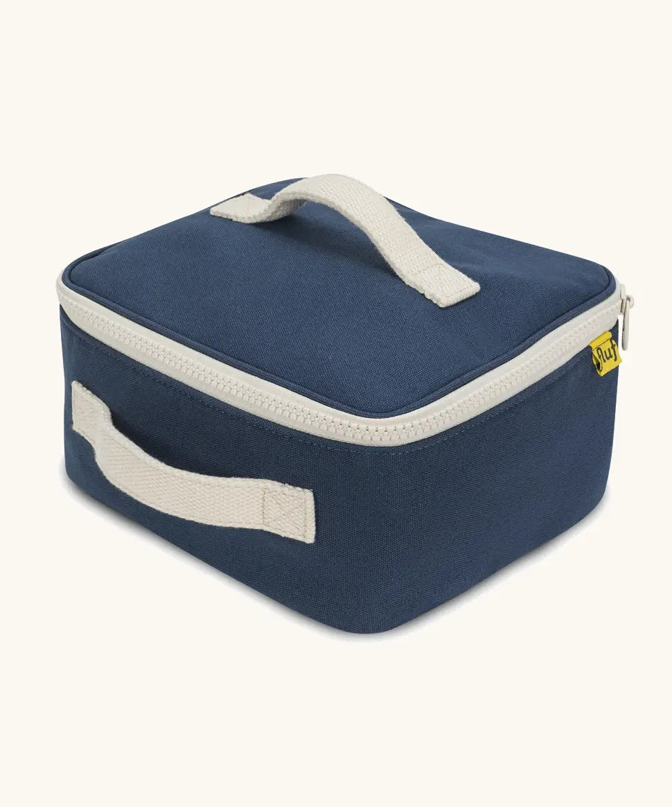 Side of a Fluf GOTS organic cotton square lunch bag in navy showing the white zip detail and carry handles